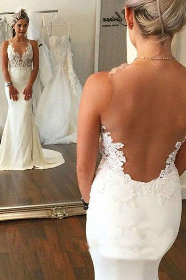 Vestidos de novia con apliques de encaje y corte sirena en la espalda
